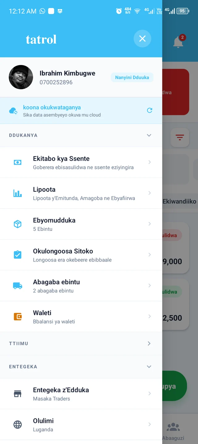 The Tatrol POS menu displayed in Luganda, showing cashbook, reports and stock